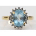 A 9ct gold aquamarine and brilliant cut diamond cluster ring, stone 10 x 8mm, O, 3.2gm