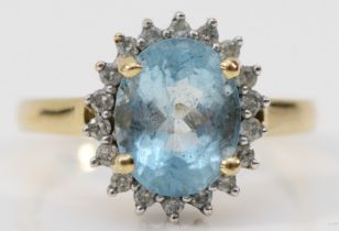 A 9ct gold aquamarine and brilliant cut diamond cluster ring, stone 10 x 8mm, O, 3.2gm