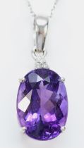 A 9ct white gold amethyst pendant, claw set with a mixed cut stone of good colour, 14 x 10mm,