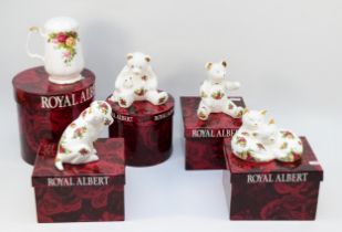 A group of Royal Albert 'Old Country Roses' porcelain models, comprising a seated dog, sleeping