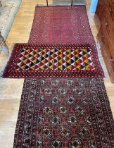 An early 20th century Persian shiraz rug, hand woven kilim cotton having deep border with aztec