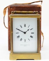 An early 20th century English brass case carriage clock, the white enamelled dial with Roman