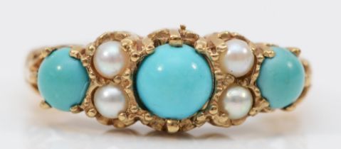 A Victorian style 9ct gold three stone turquoise ring, cultured pearl points between, carved