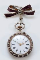 An Edwardian silver purple paste and imitation half pearl bow fob watch, London import 1908, white