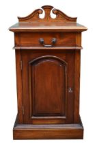 A Victorian mahogany pot cupboard, single drawer over panelled door opening to reveal a single