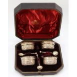 A Victorian silver set of four open salts, Birmingham 18993, with embossed decoration, three