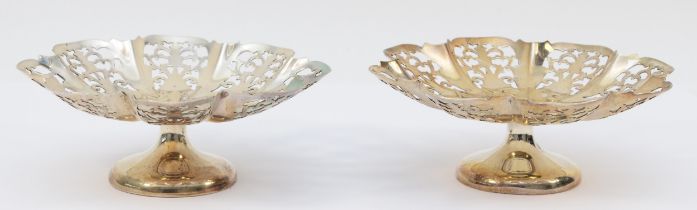 A silver pair of bon bon dishes, by Viners, Sheffield 1963, of circular lobed pierced form, raised