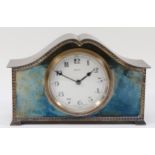 An early 20th century electroplate mantel clock, with gadrooned border, the white enamel dial with