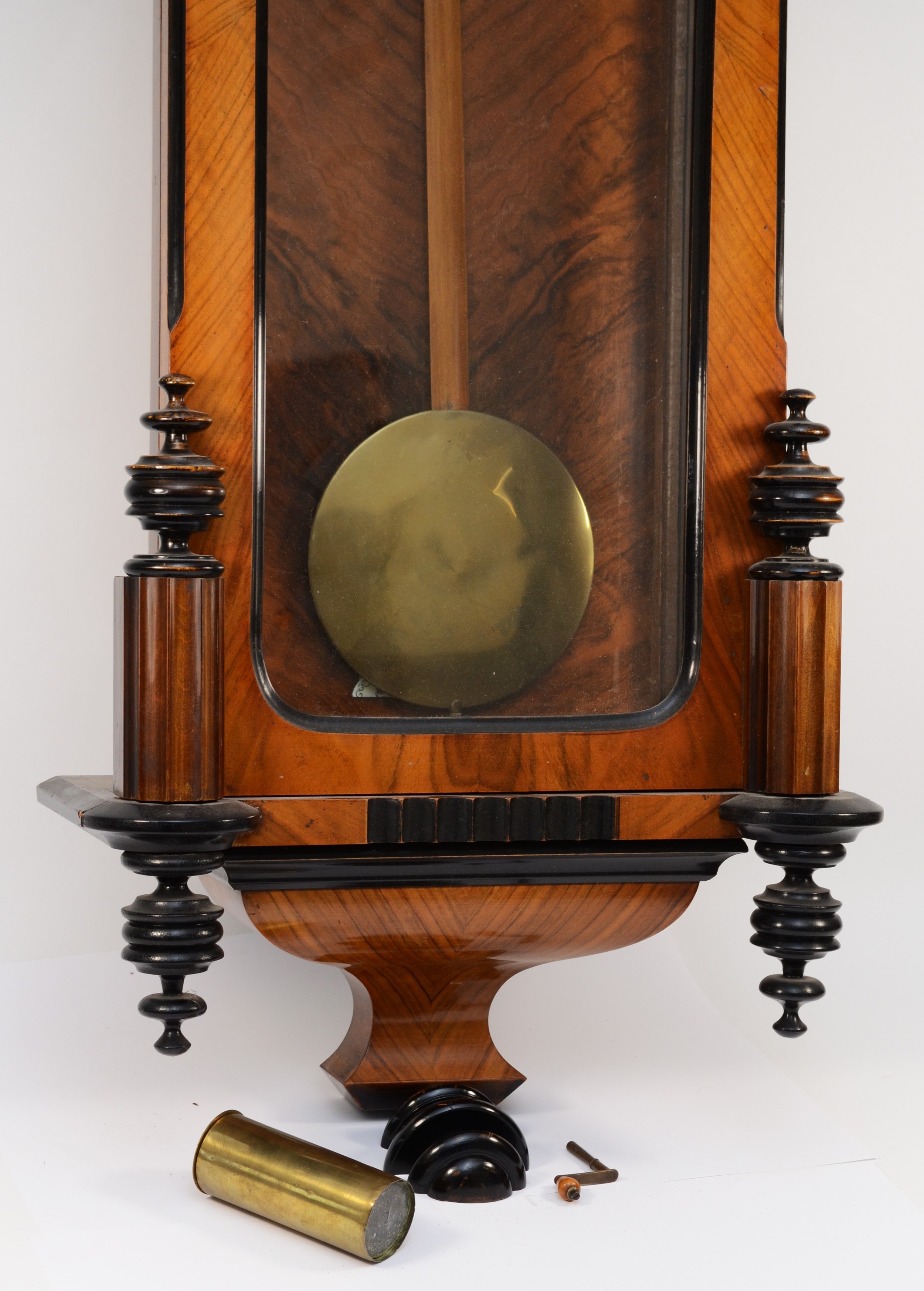 A late 19th century walnut and ebonised Vienna style wall clock, with carved pediment and finials, - Image 2 of 3