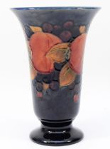 A large Moorcroft pomegranate pattern vase c.1920s, of flared form, tubelined and hand-painted in