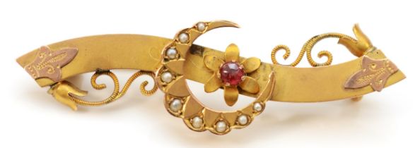 A Victorian 9ct gold red paste and half pearl crescent and scroll brooch, Chester 1898, 45mm,