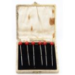 An Art Deco set of six silver and resin cherry cocktail sticks, Birmingham 1927, 8.5cm, 28gm, case