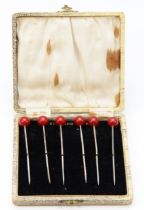 An Art Deco set of six silver and resin cherry cocktail sticks, Birmingham 1927, 8.5cm, 28gm, case