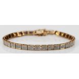 A 9ct yellow gold and diamond set panel link bracelet, each with six single cut stones, stated