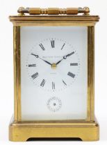 A 20th century Matthew Norman brass case carriage clock, having enamelled white dial with Roman