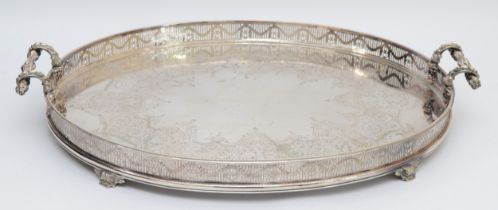 A Victorian electroplated large two handled tea tray, unmarked, with cast floral handles, pierced