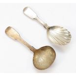 A Victorian silver fiddle pattern caddy spoon, London 1849 with floral engraved bowl and a Victorian
