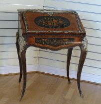 A French mahogany and walnut bureau de dame, in the Louis XV style, ormolu mounted, the cartouche