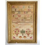 A Victorian sampler, embroidered with the alphabet, a pray, and other motifs, initialled S.J.B.,