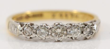 An 18ct gold and platinum vintage five stone diamond ring, claw set with graduated brilliant cut