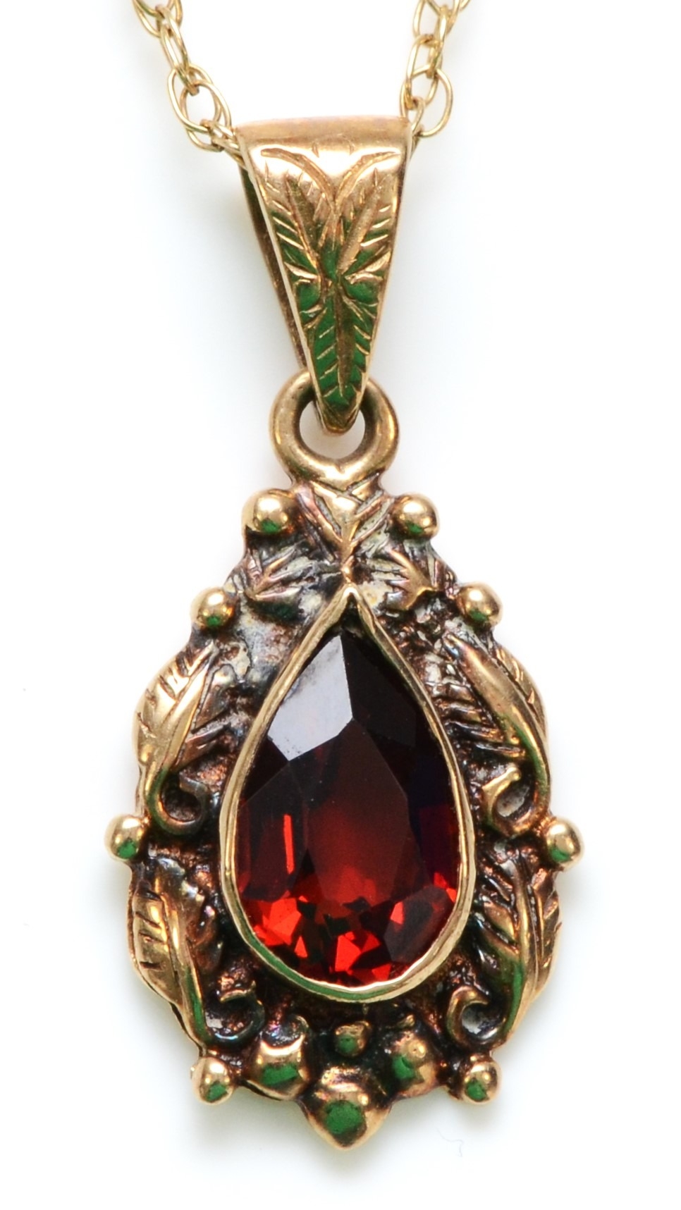 A Victorian style 9ct gold and garnet pear shape pendant 26mm overall, chain, 3gm