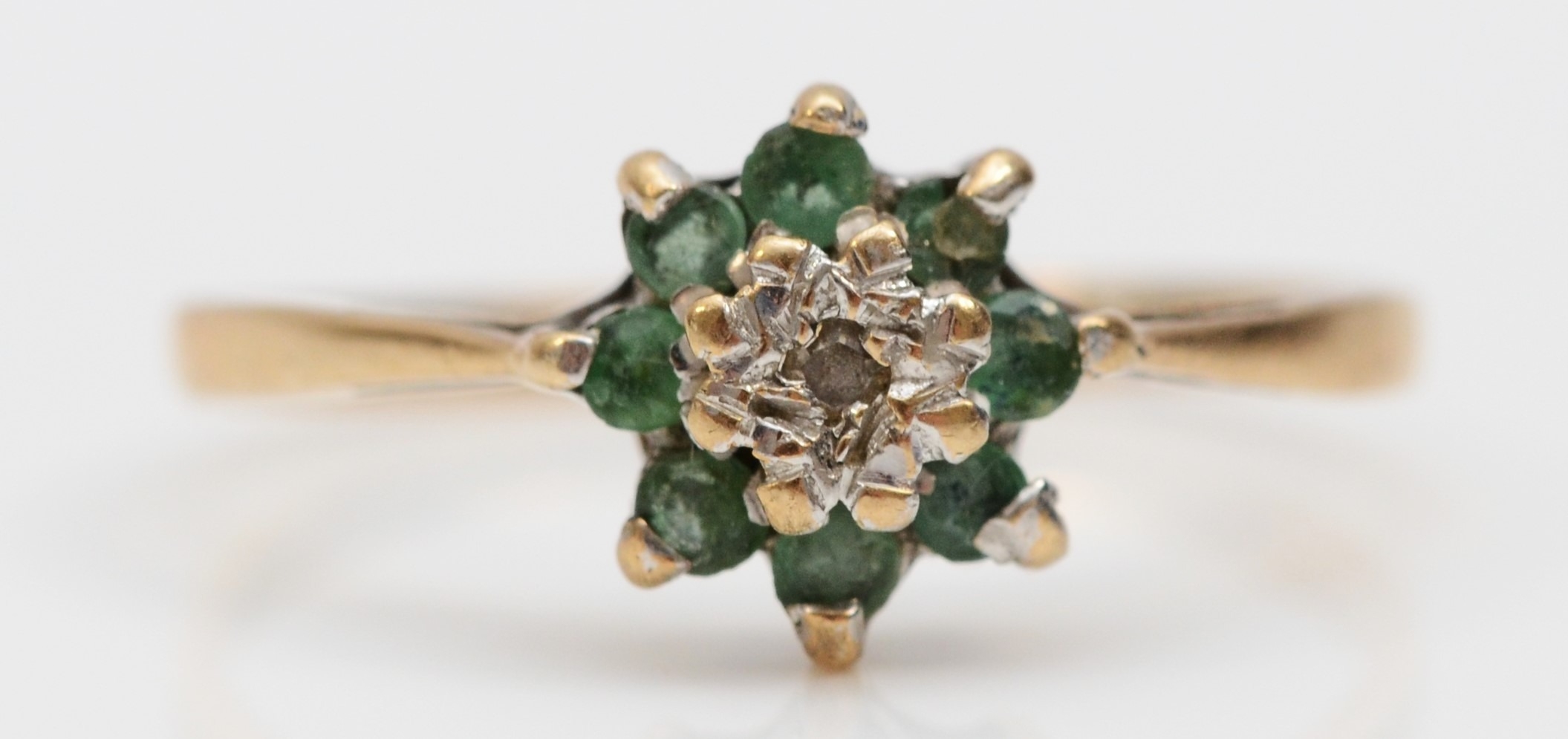 A vintage 9ct gold emerald and diamond cluster ring, M, 1.3gm
