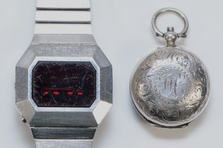 A Victorian silver sovereign case, Birmingham 1899 and an Imado LCD stainless steel gentleman's