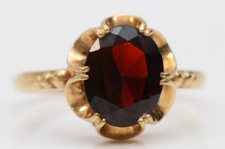 A 9ct gold and garnet dress ring, stone 10 x 8mmP, 2.2gm
