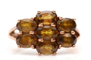 A 9ct gold and brown gemstone ring, N 1/2, 2.9gm