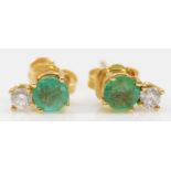An 18ct gold pair of emerald and brilliant cut diamond pair of ear studs, 0.8gm