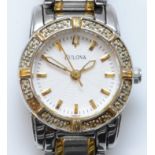 Bulova, a quartz diamond set stainless steel ladies wristwatch, the bezel set with 16 single cut