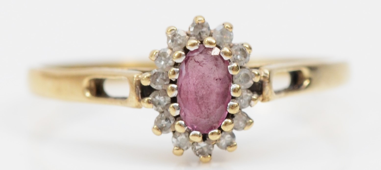 A 9ct gold ruby and diamond cluster ring, O 1/2, 1.4gm