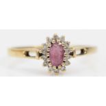 A 9ct gold ruby and diamond cluster ring, O 1/2, 1.4gm