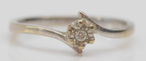 A 9ct white gold and illusion set brilliant cut diamond single stone ring, O, 2gm