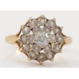 A 9ct gold and white stone cluster ring, h 1/2, 1.9gm