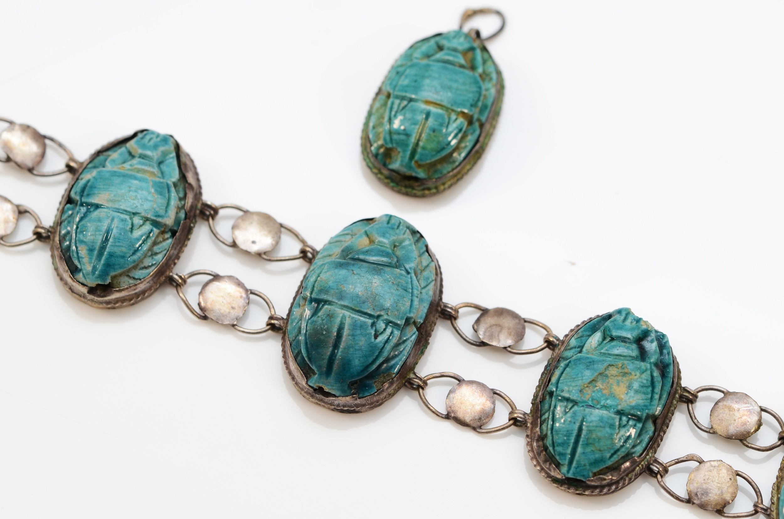 A low grade silver and faience scarab beetle bracelet, 17cm, together with a matching pendant. - Image 2 of 3