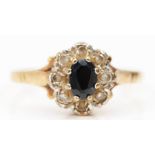A 9ct gold sapphire and white gemstone cluster ring, R, 2.2gm