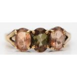 A 9ct gold pink and green tourmaline three stone ring, n 1/2, 3.1gm