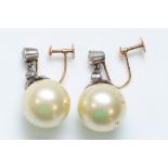 A vintage pair of 9ct gold and silver imitation 9mm pearl and paste ear rings.