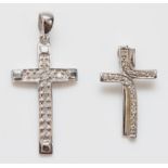 A 9ct white gold and diamond cross pendant, 30mm overall and another smaller, 2.5gm