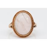 A 9ct gold and cabochon pink quartz dress ring, stone 16 x 11mm, L, 3.8gm