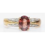 A 9ct gold purple gemstone and diamond dress ring, P, 2.8gm