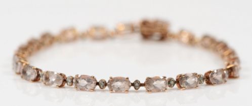 A 9k rose gold morganite and diamond tennis bracelet, 20cm, 7.8gm.