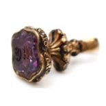 A Victorian gold cased and amethyst seal, initialled, 21mm