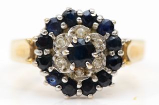A 9ct gold sapphire and eight cut diamond cluster ring, M, 2.9gm.