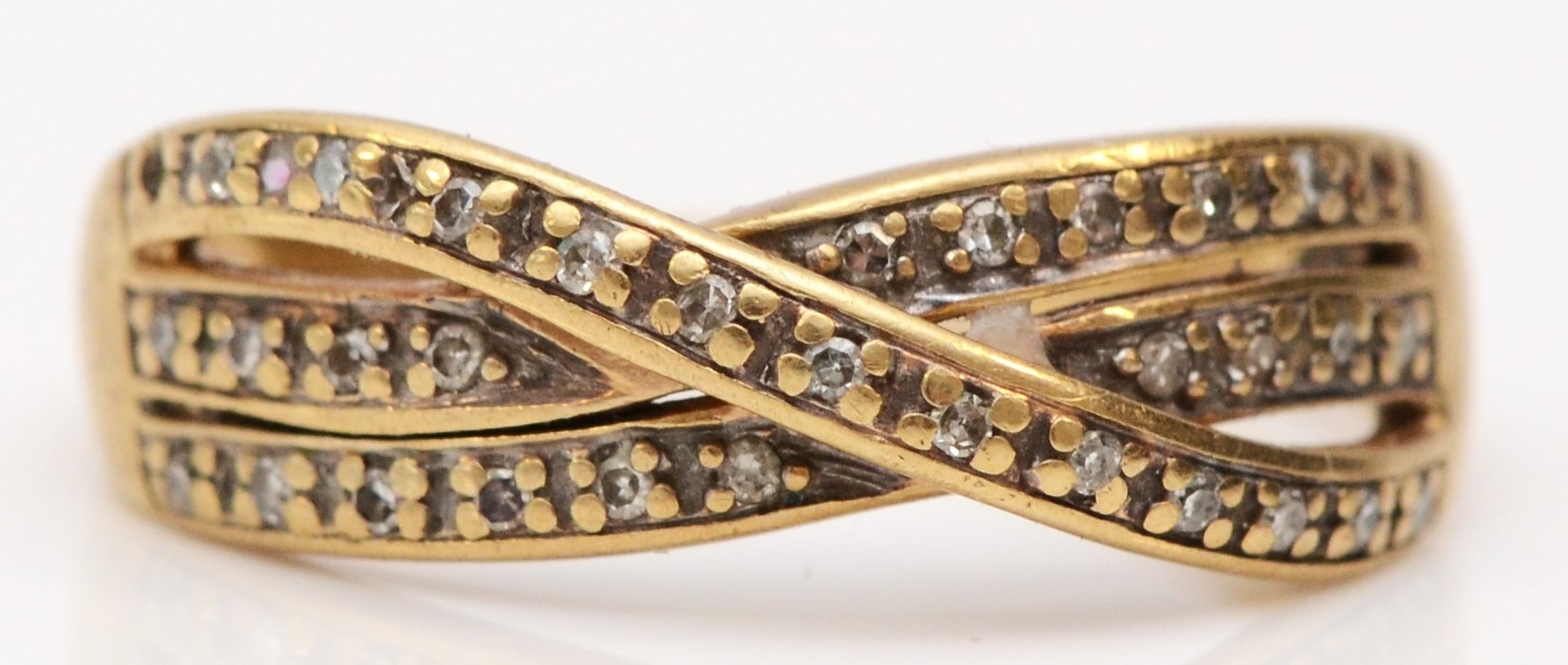 A 9ct gold single cut diamond three row twist ring, M 1/2, 2.7gm