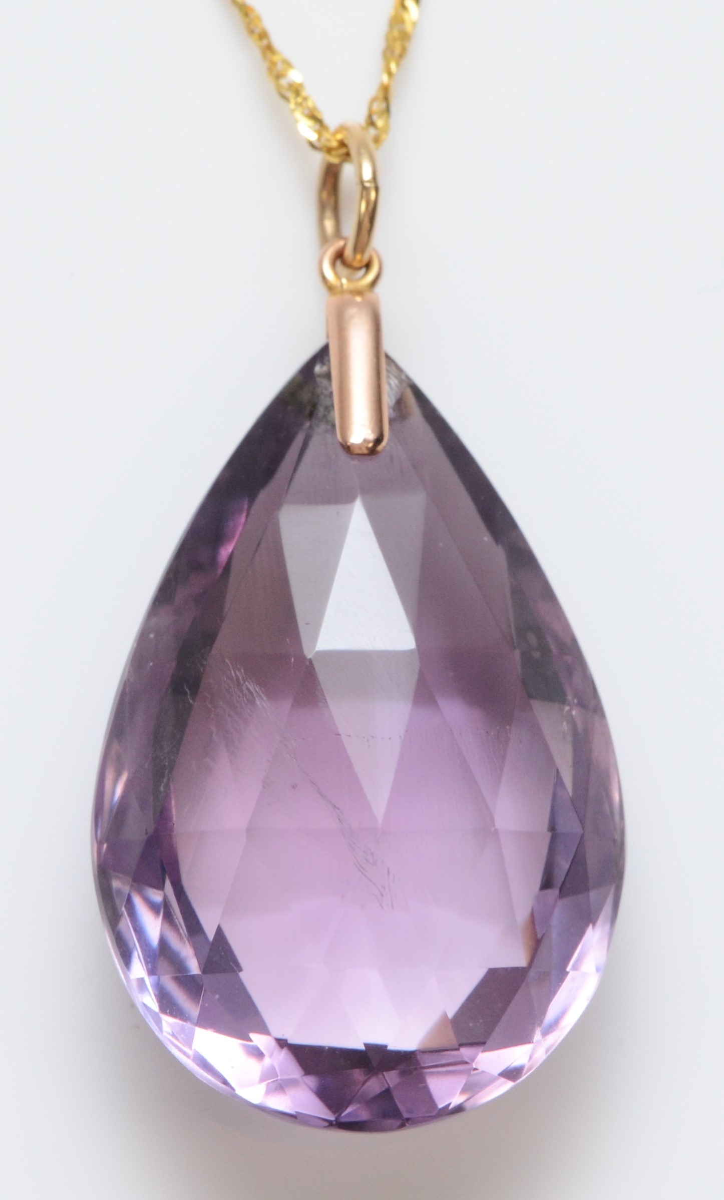 A vintage 9ct gold mounted large facetted amethyst pendant, 31 x 20mm, 9ct gold chain