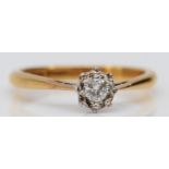 An 18ct gold and brilliant cut diamond single stone ring, M, 2.5gm
