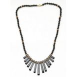 An onyx fringe necklace with 9ct gold beads, 38cm