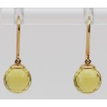 A pair of 9ct gold mounted 8mm facetted citrine ball ear rings.